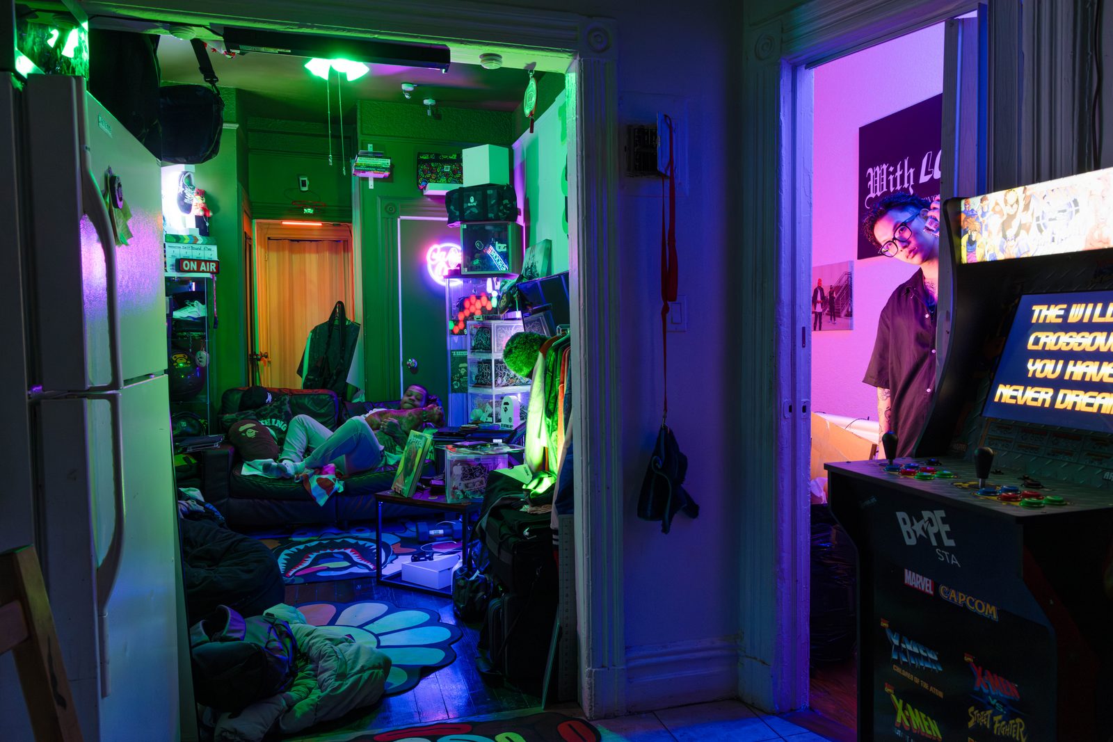 A cluttered room washed in neon green and purple light — Win or Lose